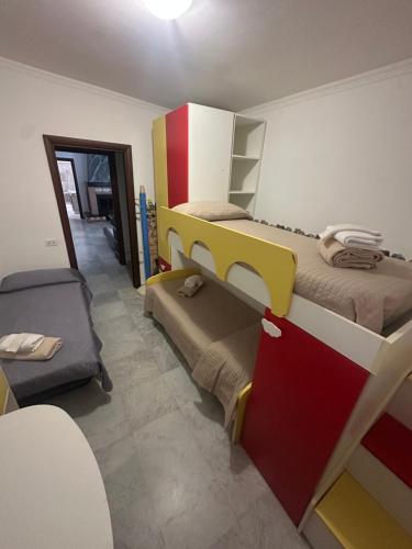 a room with two bunk beds and a couch at Villa Lelli 2 in Rome