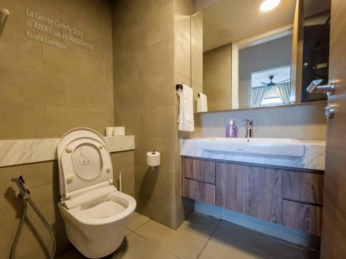 a bathroom with a toilet and a sink at 2r2b Klcc Aria Hi Luxury Amazing Facilities Zen in Kuala Lumpur