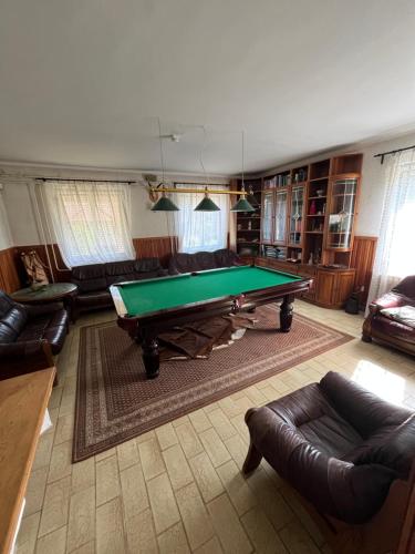 a living room with a pool table in it at PusztaHaus Pusztavám in Mór