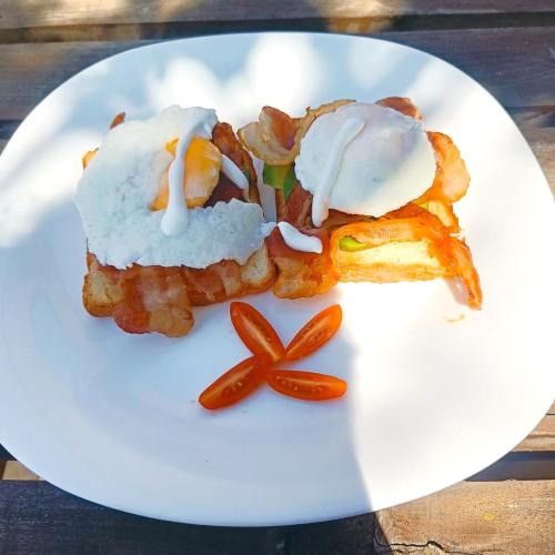 a white plate with some food on it at Skippers - Adults only in Diani Beach