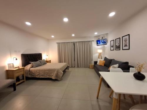 Postel nebo postele na pokoji v ubytování Departamentos del Trébol II