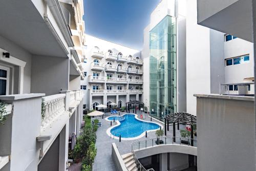 Escape24 Spacious 1BR with Pool View, JVC