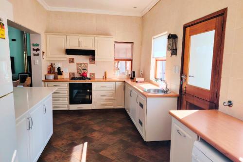 Kuchyň nebo kuchyňský kout v ubytování Haus Mikaya, Cathkin Estate by Euphoric Leisure