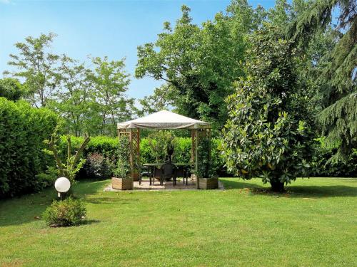 a gazebo with a table and chairs in a yard at Holiday Home Villa Felice by Interhome in Asti