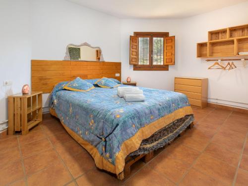 a bedroom with a large bed in a room at Holiday Home El Cerrillo - Cerro Negro by Interhome in Órgiva