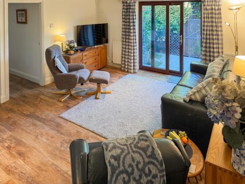 TV a/nebo společenská místnost v ubytování Picket Hill Cottage