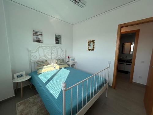 En eller flere senge i et værelse på Oliva Sol Apartment