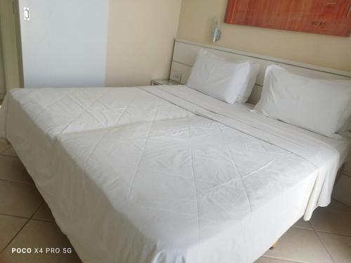 Apartamento - Differential Flat no Vale do Serenoにあるベッド