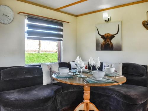 a living room with a table and a couch at Croft - Uk50042 in Clitheroe
