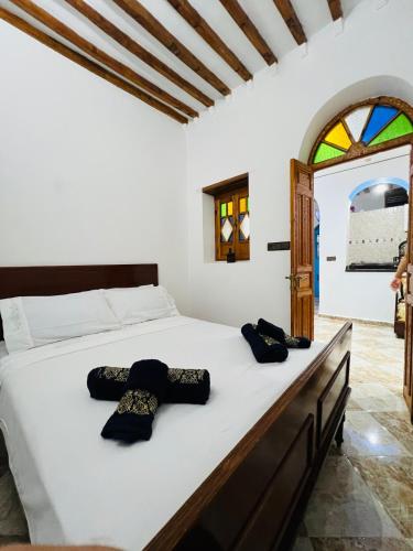 Ένα ή περισσότερα κρεβάτια σε δωμάτιο στο Dar Lala Mnana local Heart of Chaouen