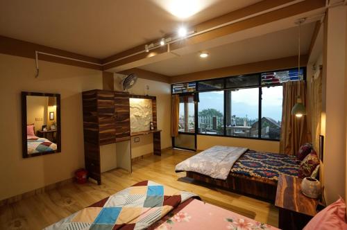 Ένα ή περισσότερα κρεβάτια σε δωμάτιο στο Hari Mang Imm 1BR-SF Mountain View Darjeeling-1