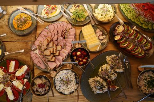 a table full of different types of food on plates at Leśniczówka u Zięby in Kościelisko