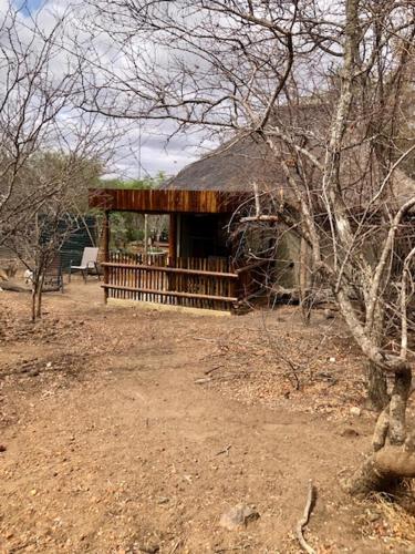 a building with a fence in front of it at NIANI HYENA chalet in Hoedspruit