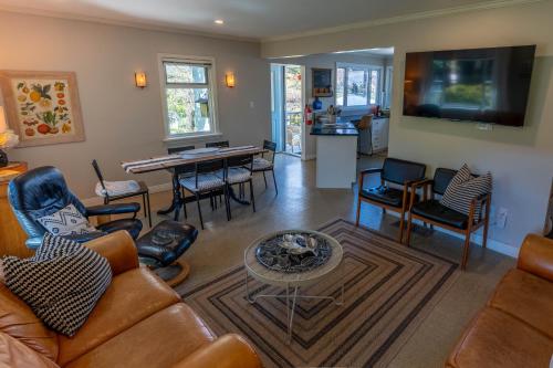 a living room with a couch and a table at Family Cottage at Horner Park in Victoria