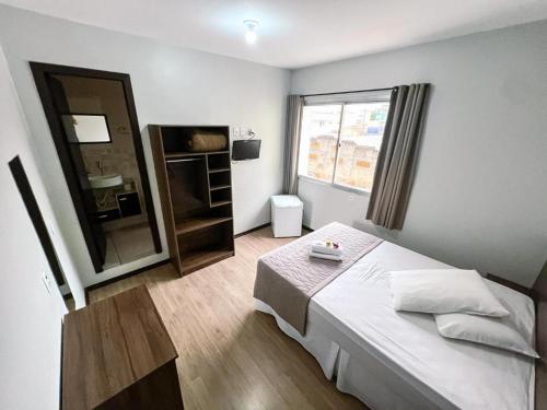 Ένα ή περισσότερα κρεβάτια σε δωμάτιο στο Hotel Zata - Econômico