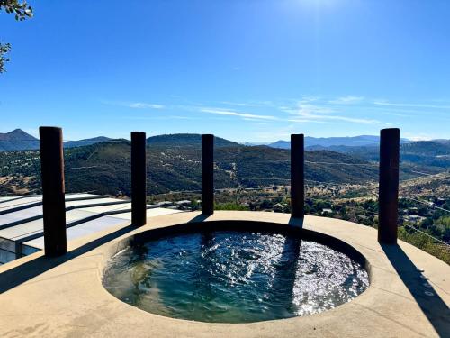 a plunge pool with a view of the mountains at Casa Zúrich in La Estación