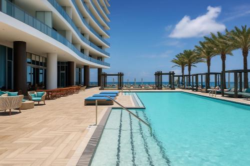 a swimming pool on the side of a building at Lyfe Residence Building - Private apts over the beach in Hollywood