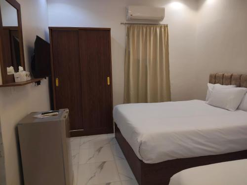 Postel nebo postele na pokoji v ubytování NEMES Pyramids View INN