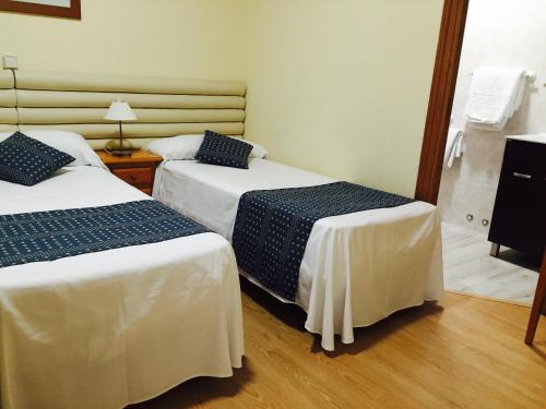 Hotel Cuatro Cañosにあるベッド
