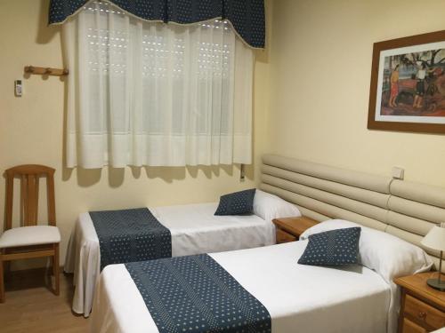 Hotel Cuatro Cañosにあるベッド