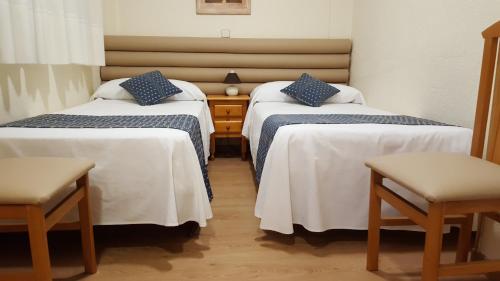 Hotel Cuatro Cañosにあるベッド