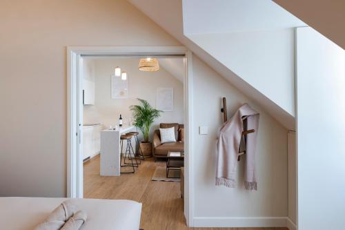 a room with a staircase leading to a living room at Ponto Alto Hotel in Lisbon
