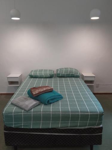 Una cama o camas en una habitación de Apartamento 501