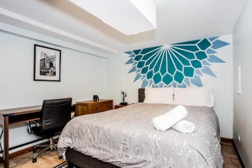 a bedroom with a bed and a desk and a desk at Stylish Garden-Level 2BR: Quiet Neighborhood in Chicago