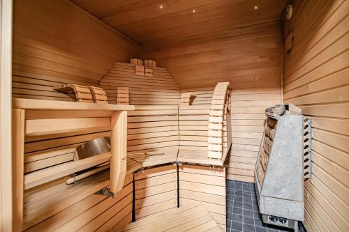 an inside of a sauna with a sink at Hellevi by Aavalevi in Levi