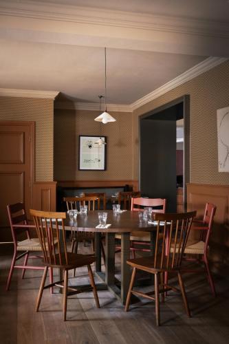 a dining room with a table and chairs at The Hide in Chesterfield