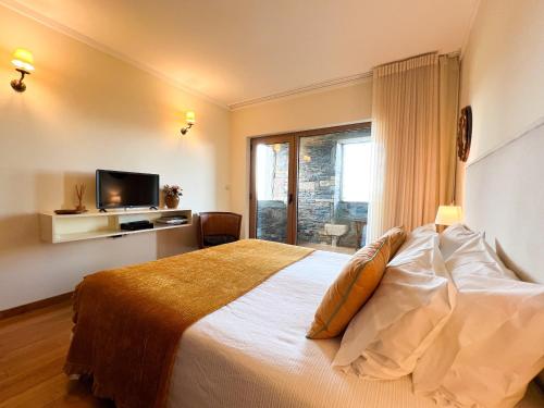 En eller flere senge i et værelse på Casa de Gouvães Turismo Rural Douro