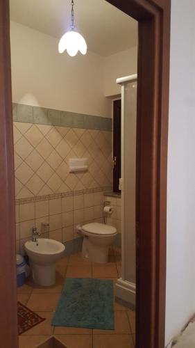 a bathroom with a toilet and a bidet at Villa Malandrino Guest House in Agropoli