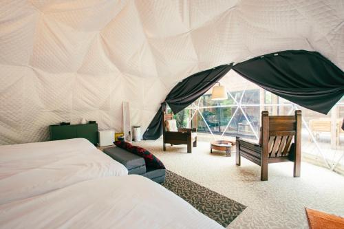 a bedroom with a bed and a tent at Yura Green - Vacation STAY 65842v in Yura