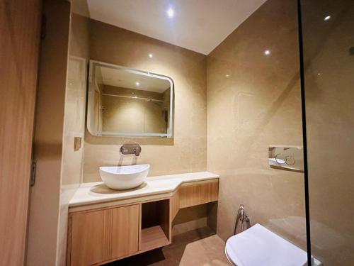 a bathroom with a sink and a shower at Hotel The Elite in Jabalpur