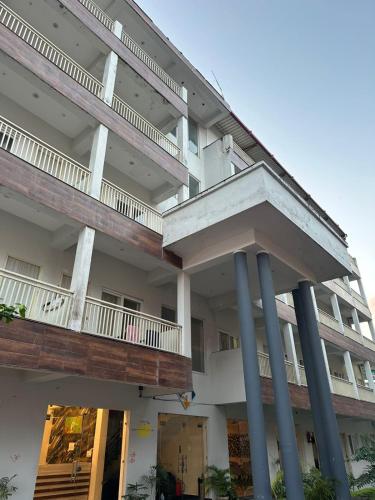 an external view of a building with two balconies at Ganga villa in Jāmb