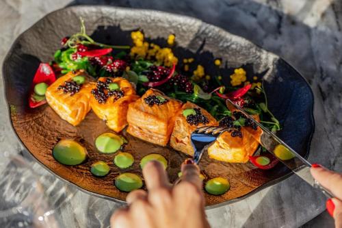 a plate of food on a table with a plate of food at ORBI CITY - ELIT LUXURY hotel in Batumi