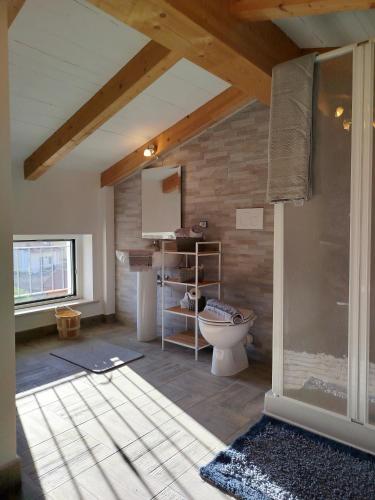 a bathroom with a toilet in a room at La Chioma di Berenice in Celano