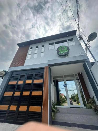 a building with a sign on the front of it at Tony's City Centered Budget Room in San Fernando