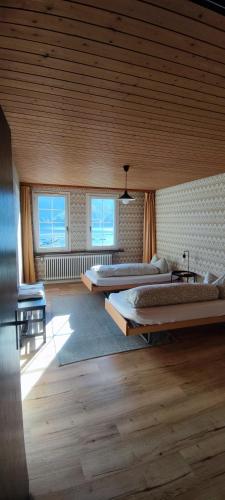 a large room with two beds in it at Fischers Fritz in Innerthal