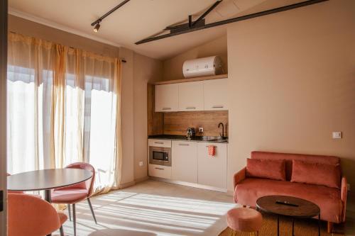 a living room with a couch and a table at La Fabbrica del Mediterraneo Apartments in Denia