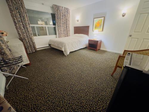 Postel nebo postele na pokoji v ubytování Mana's guest suite