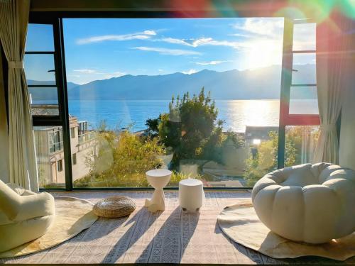 a room with a large window with a view of the ocean at sea konws NO2 in Dali Airport