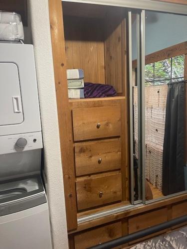a kitchen with a dresser and a window in a room at Mystic Ivy in Marblemount