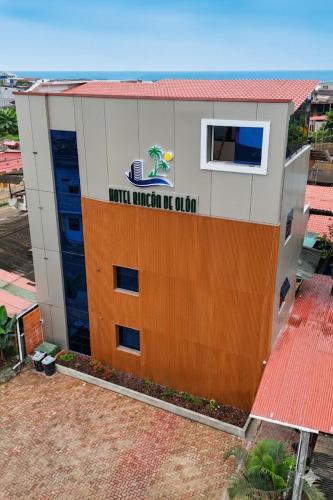 a building with a sign on the side of it at Rincón d'Olón Boutique Hotel in Olón