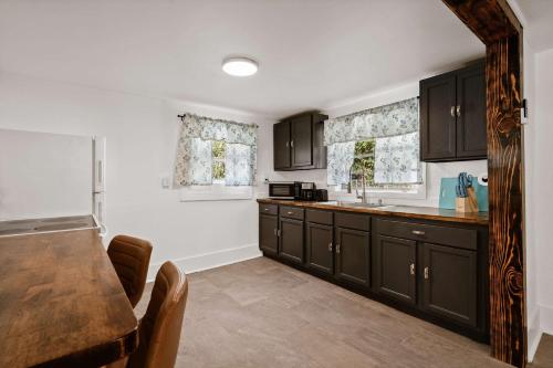a kitchen with black cabinets and a counter top at Blue Ox in Pensacola