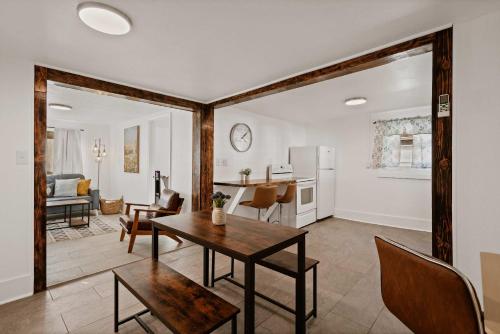 a living room with a table and a kitchen at Blue Ox in Pensacola