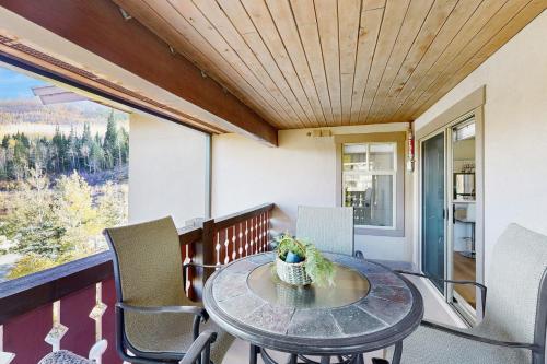 a table and chairs on a balcony with a view at Eagle Springs East 315: Osprey Suite in Solitude