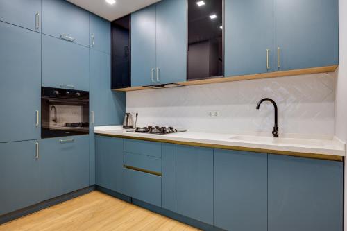 Η κουζίνα ή μικρή κουζίνα στο Hilton Apartment