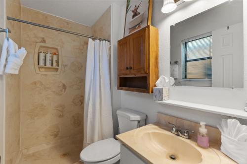 a bathroom with a sink and a toilet and a shower at Steps From Balloon Fiesta Park Outdoor Retreat in Albuquerque