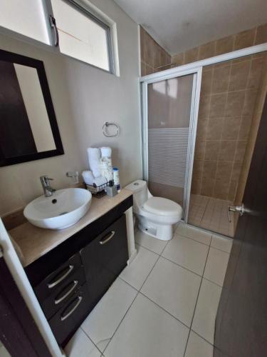 a bathroom with a sink and a toilet and a shower at Sea View 10 Boca Towers in Boca del Río